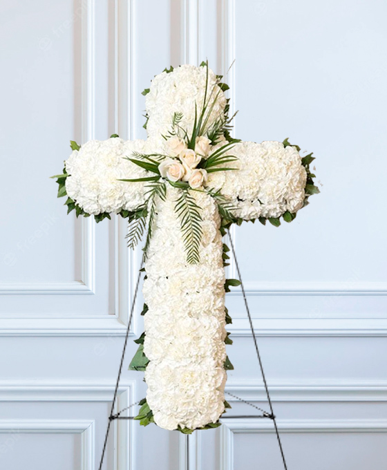 Cruz funeraria con clavel blanco para Badalona